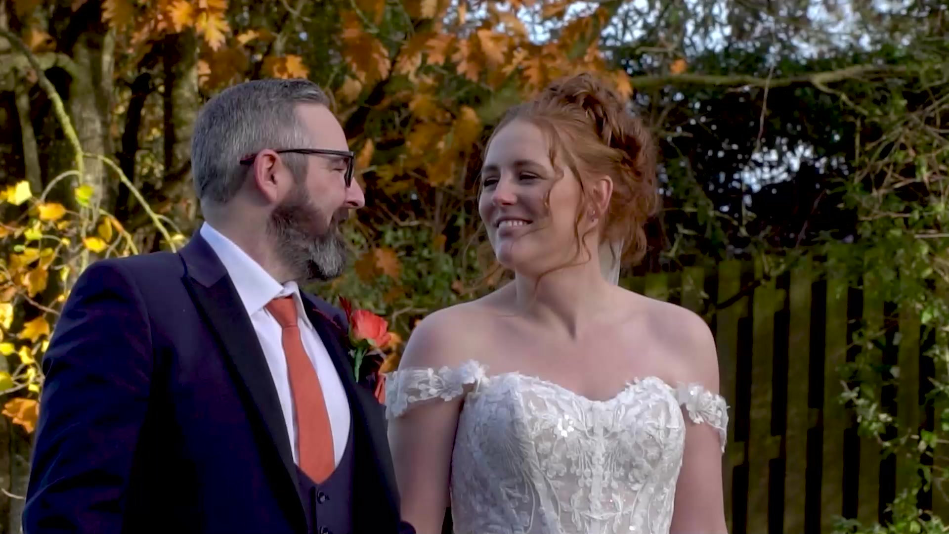 A newly married couple sharing a quiet moment outdoors
